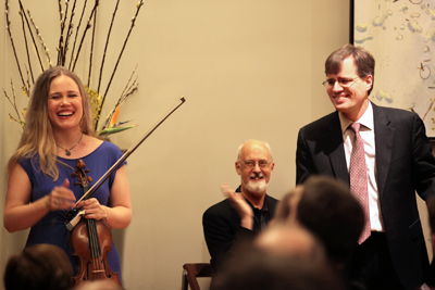 Leila , Charles (Charlie) Hamlen and John Novacek enjoy the applause of the audience. Charlie graciously agreed to turn pages for John just before the start of the concert. - Photo by Steve J. Sherman